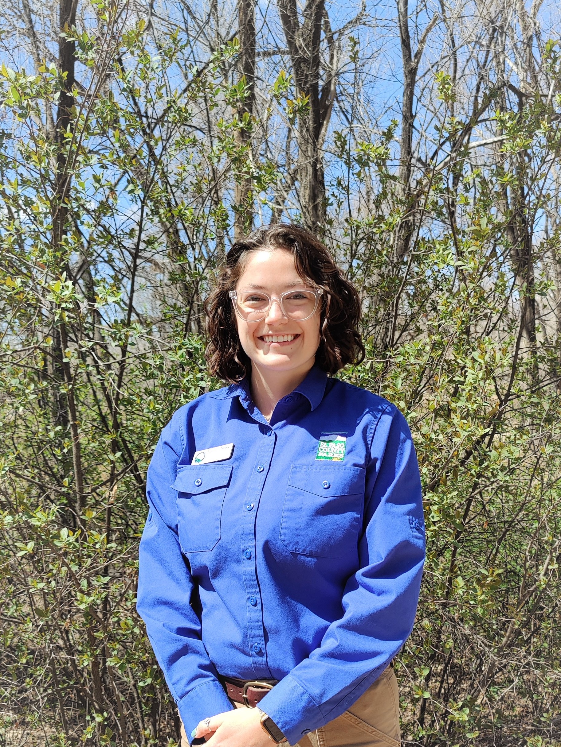 Image of Fountain Creek Nature Center's Interpretive Program Coordinator Victoria Dinkel standing in an outdoor setting